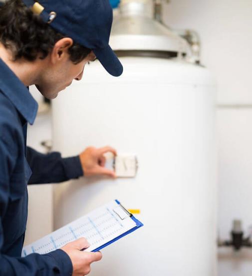 Tech working on a boiler